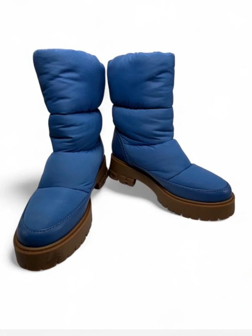Coach Rya Boots inSky Blue. Quilted puffer-style nylon, leather upper.